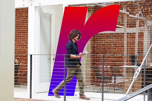 someone walking in front of a gradient R