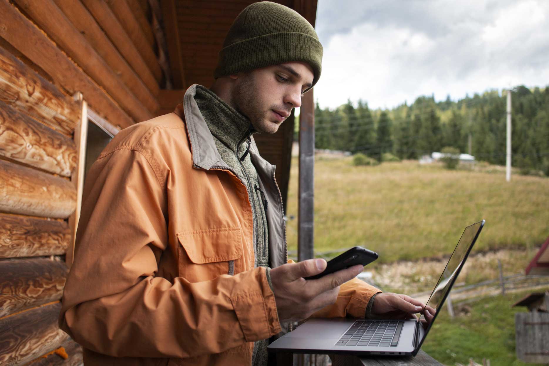 Man working in his computer in the field