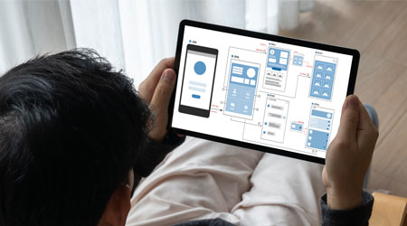 a person holding an ipad