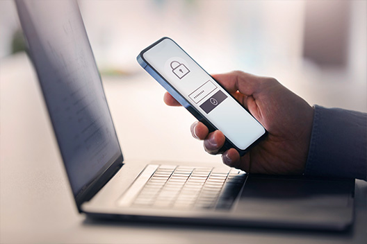 Man holding a phone where prompting for his password