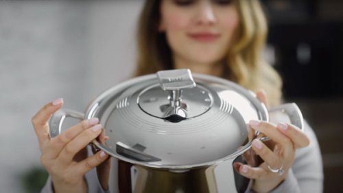 Woman holding a Rena Ware cookware