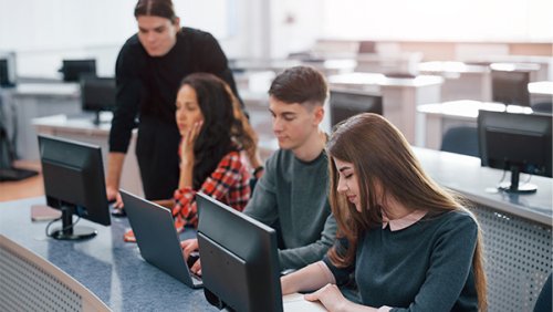 Young students working in their computers